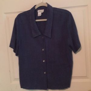 Size measures 22” wide at bust and 23 1/2” length